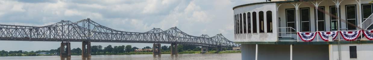 https://easyads.biz/wp-content/uploads/2022/03/Detail-of-a-steamer-boat-and-the-bridge-over-the-Mississippi-River-flows-near-Natchez-Mississippi.jpg