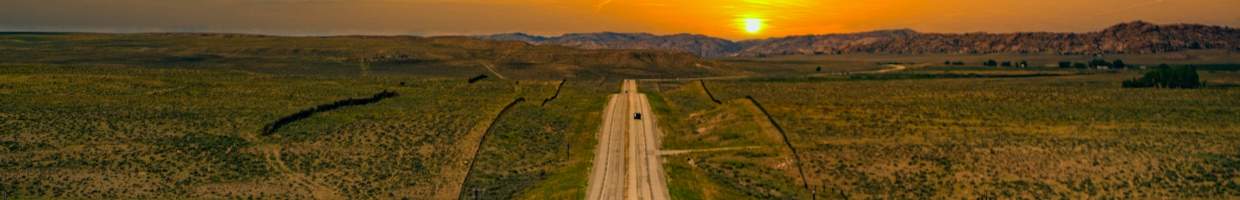 https://easyads.biz/wp-content/uploads/2022/03/Long-road-into-the-sunset-near-Cody-Wyoming.jpg