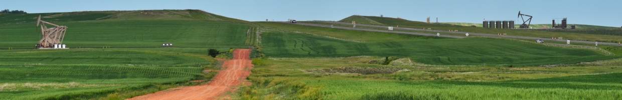 https://easyads.biz/wp-content/uploads/2022/03/Oil-Pumps-and-Farm-Fields-along-a-road-near-Dickinson-North-Dakota.jpg