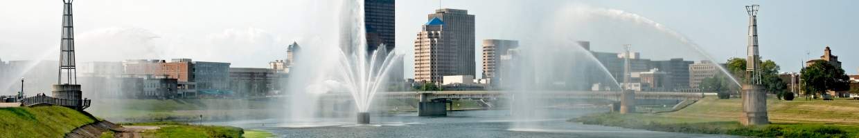 https://easyads.biz/wp-content/uploads/2022/03/Skyline-of-Dayton-Ohio-as-seen-through-spraying-fountains.jpg